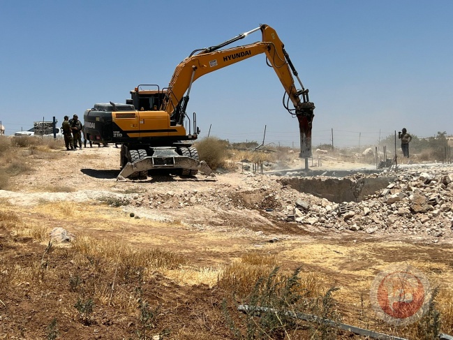 The occupation demolishes two houses and a water well east of Yatta