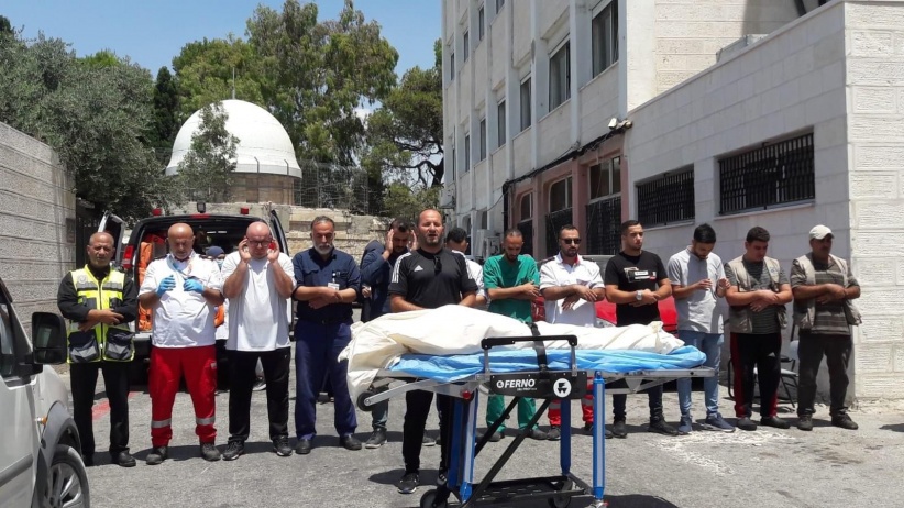 Jerusalemites perform the funeral prayer for the child martyr Lian