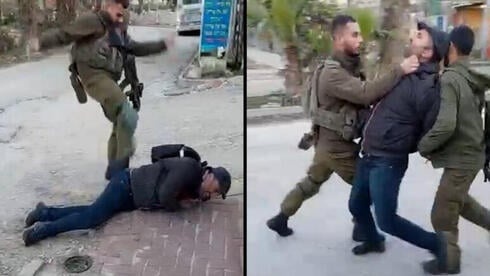 A soldier beats an activist in Hebron