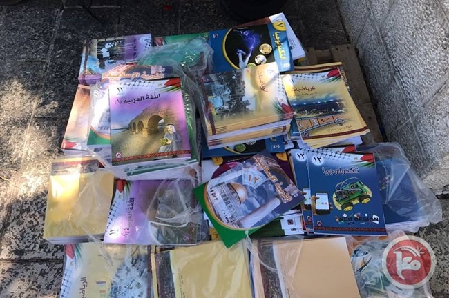 Distribution of the Palestinian curriculum to schoolchildren in Shuafat camp in Jerusalem